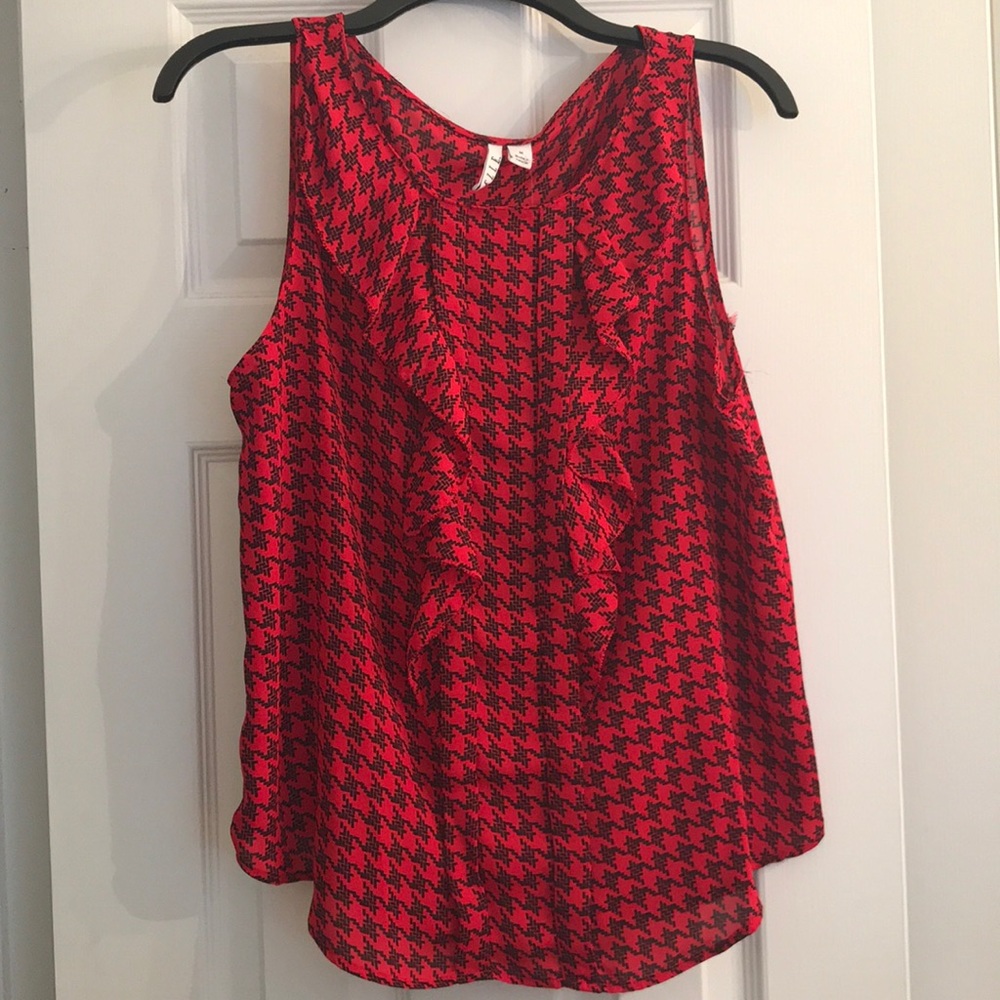 Sleeveless red blouse